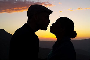 Man and woman kissing in silhouette. Copyright: BBC