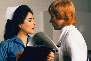 The National Health. Image shows from L to R: Sister McFee / Sister Mary MacArthur (Eleanor Bron), Barnet / Dr. Neil Boyd (Jim Dale). Copyright: Virgin