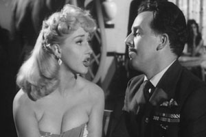 The Night We Dropped A Clanger. Image shows from L to R: Lulu (Liz Fraser), Wing Cmdr. Blenkinsop (Brian Rix). Copyright: Four Star Films