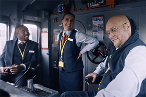 The Train. Image shows left to right: Jason (Kiell Smith-Bynoe), Rona (Lucy Pearman), Russell (Tim Key)