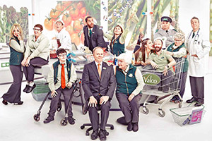 Trollied. Image shows from L to R: Linda (Faye McKeever), Sue (Lorraine Cheshire), Neville (Dominic Coleman), Harry (Jack Carroll), Daniel (Samuel Anderson), Gavin (Jason Watkins), Charlie (Aisling Bea), Margaret (Rita May), Lisa (Beverly Rudd), Colin (Carl Rice), Ian (Victor McGuire), Rose (Miriam Margolyes), Brian (Stephen Tompkinson). Copyright: Roughcut Television