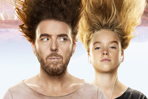 Upright. Image shows left to right: Lucky Flynn (Tim Minchin), Meg Adams (Milly Alcock)