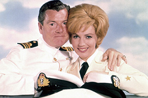 We Joined The Navy. Image shows left to right: Lieutenant Commander Robert 'Bodger' Badger (Kenneth More), Carol (Joan O'Brien). Credit: STUDIOCANAL