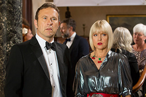 Agatha Raisin. Image shows from L to R: Sir Charles Fraith (Jason Merrells), Agatha Raisin (Ashley Jensen)