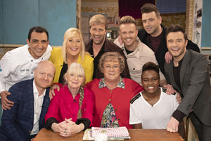 All Round To Mrs. Brown's. Image shows from L to R: Aly Mahmoud, Jake Wood, Cathy Brown (Jennifer Gibney), Joelle Wood, Kian Egan, Mrs Brown (Brendan O'Carroll), Nicky Byrne, Mark Feehily, Nicola Adams, Shane Filan