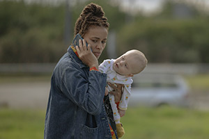 The Baby. Image shows from L to R: Natasha (Michelle De Swarte), The Baby (Albie Pascal Hills), The Baby (Arthur Levi Hills)