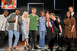 BBC New Comedy Awards. Image shows left to right: Babatunde Aléshé, Darren Harriott, Holly Ludlow, Dane Buckley, Sharon Wanjohi, Kathy Rivett, Hasan Al-Habib, Sukh Ojla, Jack Rooke