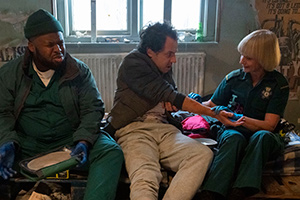 Bloods. Image shows from L to R: Maleek (Samson Kayo), Crackhead John (Dustin Demri-Burns), Wendy (Jane Horrocks). Copyright: Roughcut Television