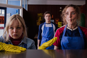 Derry Girls. Image shows from L to R: Clare Devlin (Nicola Coughlan), James Maguire (Dylan Llewellyn), Orla McCool (Louisa Harland). Copyright: Hat Trick Productions