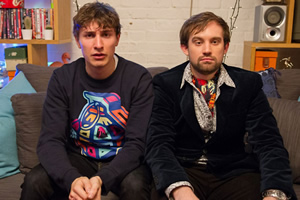 Flat TV. Image shows from L to R: Tom (Tom Rosenthal), Naz (Naz Osmanoglu). Copyright: BBC