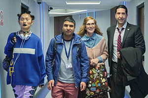 Intelligence. Image shows from L to R: Tuva Olsen (Gana Bayarsaikhan), Joseph Harries (Nick Mohammed), Mary Needham (Jane Stanness), Jerry Bernstein (David Schwimmer)