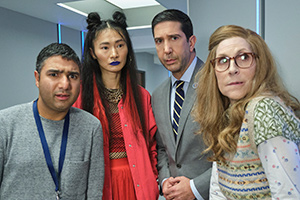 Intelligence. Image shows from L to R: Joseph Harries (Nick Mohammed), Tuva Olsen (Gana Bayarsaikhan), Jerry Bernstein (David Schwimmer), Mary Needham (Jane Stanness)