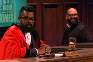 Judge Romesh. Image shows from L to R: Romesh Ranganathan, Court Bailiff (Tom Davis). Copyright: Hungry Bear Media