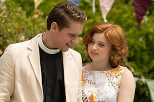 The Larkins. Image shows left to right: Reverend Ian Candy (Maxim Ays), Primrose Larkin (Lydia Page)