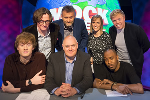 Mock The Week. Image shows from L to R: James Acaster, Ed Byrne, Hugh Dennis, Dara O Briain, Holly Walsh, Dane Baptiste, Rob Beckett