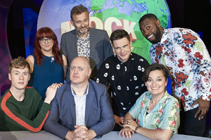 Mock The Week. Image shows from L to R: James Acaster, Angela Barnes, Hugh Dennis, Dara O Briain, Ed Gamble, Darren Harriott, Zoe Lyons. Copyright: Angst Productions