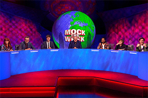 Mock The Week. Image shows from L to R: Angela Barnes, Hugh Dennis, Glenn Moore, Dara O Briain, Ahir Shah, Maisie Adam, Ed Gamble. Copyright: Angst Productions