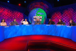Mock The Week. Image shows from L to R: Felicity Ward, Hugh Dennis, Rhys James, Dara O Briain, Darren Harriott, Catherine Bohart, Ed Byrne. Copyright: Angst Productions