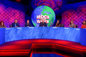 Mock The Week. Image shows from L to R: Angela Barnes, Hugh Dennis, Jonny Pelham, Dara O Briain, Rhys James, Laura Lexx, Ahir Shah