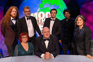 Mock The Week. Image shows left to right: Alasdair Beckett-King, Angela Barnes, Hugh Dennis, Dara O Briain, Rhys James, Ahir Shah, Zoe Lyons