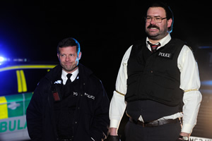 Murder In Successville. Image shows from L to R: Dermot O'Leary, DI Sleet (Tom Davis). Copyright: Tiger Aspect Productions