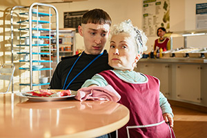 Piglets. Image shows left to right: Paul (Jamie Bisping), Aunty Nooch (Kiruna Stamell)