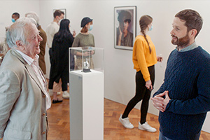 Pls Like. Image shows from L to R: Gallery Owner (Richard Syms), Liam (Liam Williams)