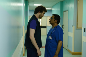 Porters. Image shows from L to R: Simon Porter (Edward Easton), Mr. Pradeep (Sanjeev Bhaskar)