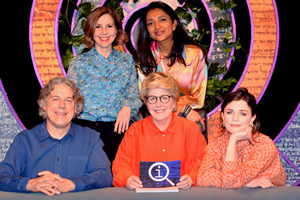 QI. Image shows from L to R: Alan Davies, Sally Phillips, Sindhu Vee, Sandi Toksvig, Aisling Bea