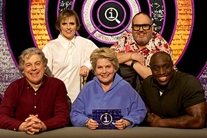 QI. Image shows left to right: Alan Davies, Holly Walsh, Sandi Toksvig, Justin Moorhouse, Emmanuel Sonubi