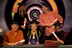 QI. Image shows left to right: Alan Davies, Morgana Robinson, Sandi Toksvig, Joe Lycett, Guz Khan