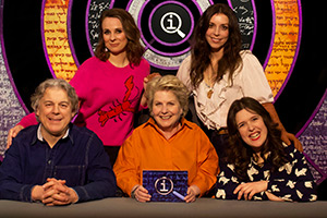 QI. Image shows left to right: Alan Davies, Cariad Lloyd, Sandi Toksvig, Bridget Christie, Rosie Jones