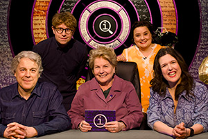 QI. Image shows left to right: Alan Davies, Josh Widdicombe, Sandi Toksvig, Susan Calman, Rosie Jones