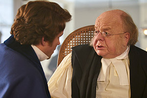 Quacks. Image shows from L to R: Robert (Rory Kinnear), Bishop of Lambeth (Roger Ashton-Griffiths). Copyright: Lucky Giant