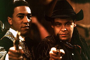 Red Dwarf. Image shows left to right: Cat (Danny John-Jules), Lister (Craig Charles). Credit: BBC