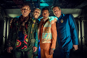 Red Dwarf. Image shows from L to R: Lister (Craig Charles), Kryten (Robert Llewellyn), Cat (Danny John-Jules), Rimmer (Chris Barrie)