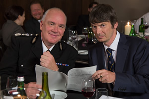 Scot Squad. Image shows from L to R: Chief Commissioner Cameron Miekelson (Jack Docherty), Ian Rankin. Copyright: The Comedy Unit