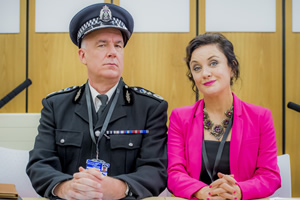 Scot Squad. Image shows from L to R: Chief Commissioner Cameron Miekelson (Jack Docherty), Barbara Edwards (Lorraine McIntosh). Copyright: The Comedy Unit