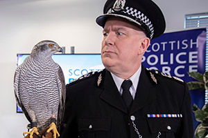 Scot Squad. Chief Commissioner Cameron Miekelson (Jack Docherty). Copyright: The Comedy Unit