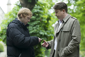 Sick Note. Image shows from L to R: Daniel Glass (Rupert Grint), Officer Hayward (Daniel Rigby). Copyright: King Bert Productions