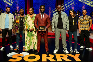 Sorry, I Didn't Know. Image shows left to right: Peter Rethinasamy, Gina Yashere, Chizzy Akudolu, Jimmy Akingbola, Eddie Kadi, Fiona Allen, Munya Chawawa