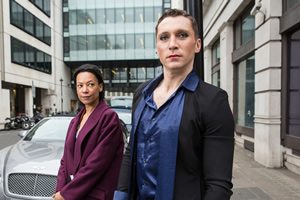 W1A. Image shows from L to R: Lucy Freeman (Nina Sosanya), Ryan Chelford (Ben Batt). Copyright: BBC