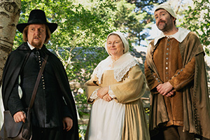 The Witchfinder. Image shows from L to R: Gideon Bannister (Tim Key), Mrs Jennings (Rosie Cavaliero), Minister Jennings (Dan Mersh)