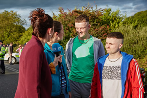 The Young Offenders. Image shows from L to R: News Reporter (Joy Buckle), Mairead MacSweeney (Hilary Rose), Jock O'Keeffe (Chris Walley), Conor MacSweeney (Alex Murphy)