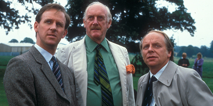 A Very Peculiar Practice. Image shows left to right: Stephen Daker (Peter Davison), Jock McCannon (Graham Crowden), Ernest Hemmingway (John Bird). Credit: BBC