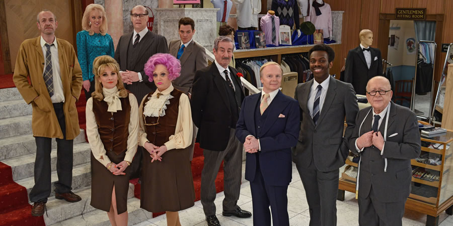 Are You Being Served?. Image shows from L to R: Mr Harman (Arthur Smith), Miss Croft (Jorgie Porter), Miss Brahms (Niky Wardley), Mr Rumbold (Justin Edwards), Mrs Slocombe (Sherrie Hewson), Young Mr Grace (Mathew Horne), Captain Peacock (John Challis), Mr Humphries (Jason Watkins), Mr Conway (Kayode Ewumi), Mr Grainger (Roy Barraclough). Copyright: BBC