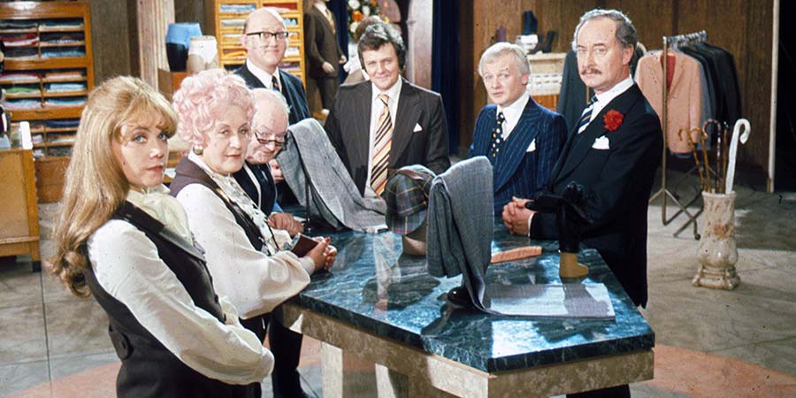 Are You Being Served?. Image shows from L to R: Miss Shirley Brahms (Wendy Richard), Mrs. Betty Slocombe (Mollie Sugden), Mr. Ernest Grainger (Arthur Brough), Mr. Cuthbert Rumbold (Nicholas Smith), Mr. Dick Lucas (Trevor Bannister), Mr. Wilberforce Clayborne Humphries (John Inman), Captain Stephen Peacock (Frank Thornton). Copyright: Anglo-EMI