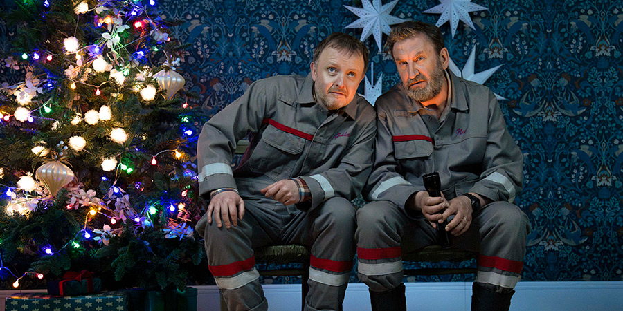 Bad Tidings. Image shows left to right: Scott (Chris McCausland), Neil (Lee Mack)