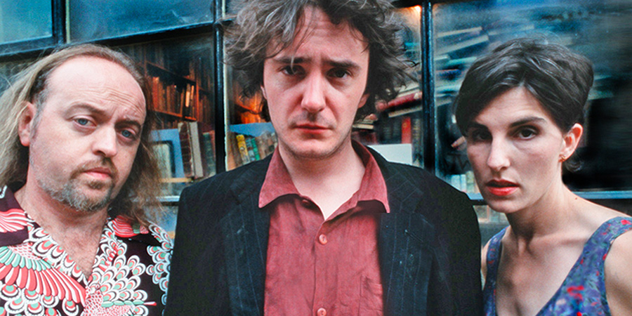 Black Books. Image shows left to right: Manny Bianco (Bill Bailey), Bernard Black (Dylan Moran), Fran Katzenjammer (Tamsin Greig). Credit: Assembly Film And Television Black Books. Image shows left to right: Manny Bianco (Bill Bailey), Bernard Black (Dylan Moran), Fran Katzenjammer (Tamsin Greig). Credit: Assembly Film And Television