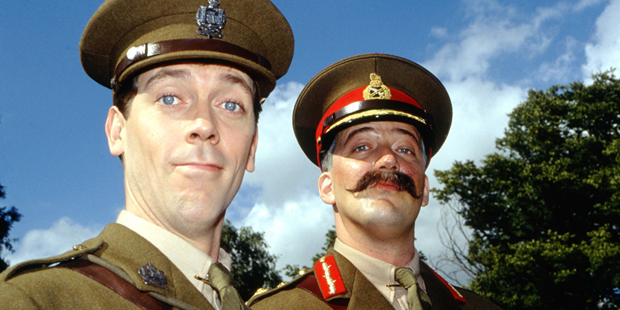 Blackadder. Image shows left to right: Lieutenant George Barleigh (Hugh Laurie), General Melchett (Stephen Fry)